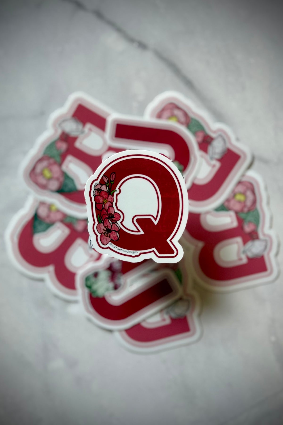 "Q" Sticker