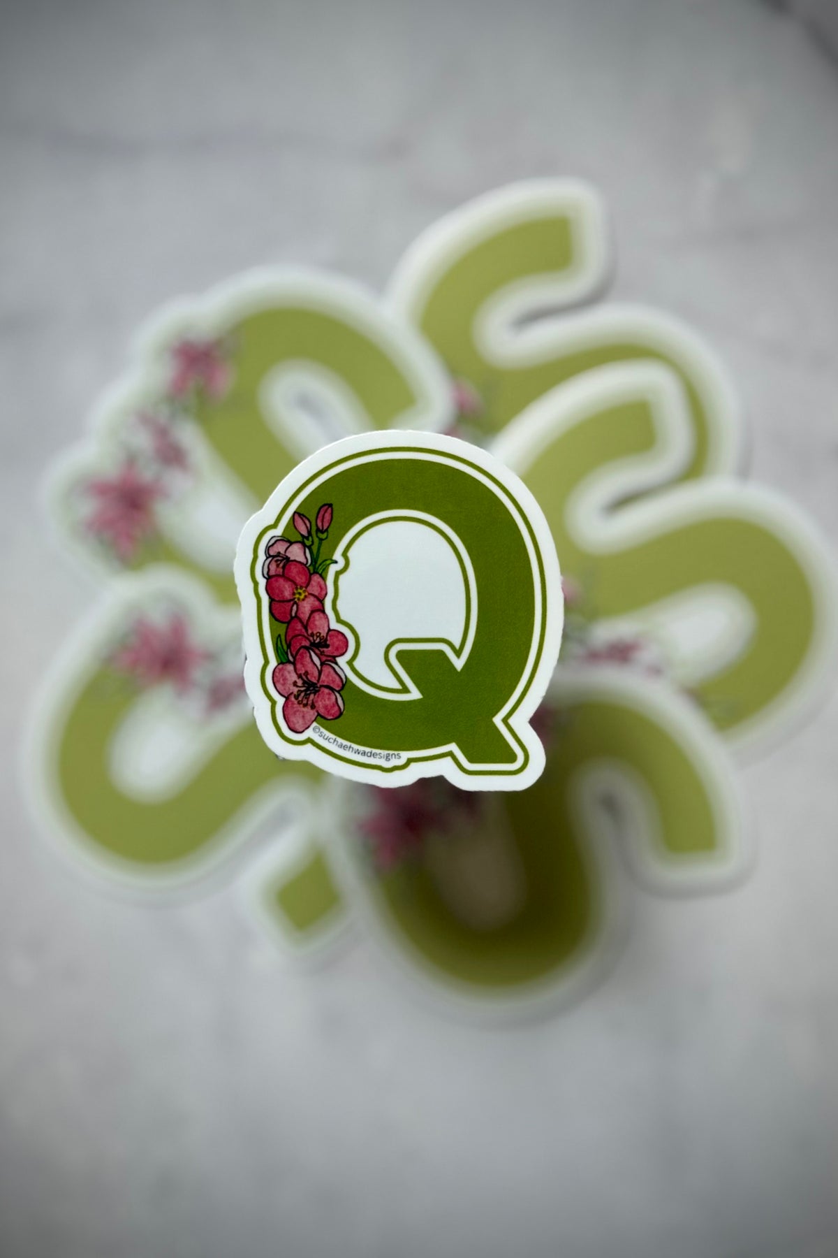 "Q" Sticker